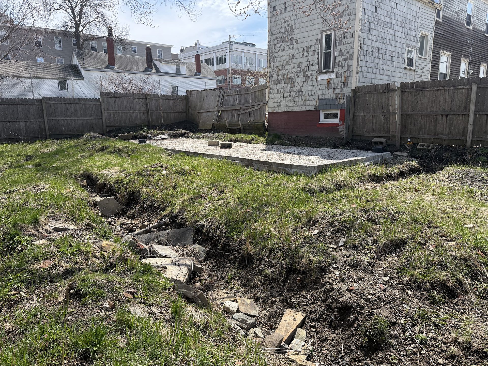 Ground-level view of the vacant 200 Oxford lot showing one of the two concrete slabs.