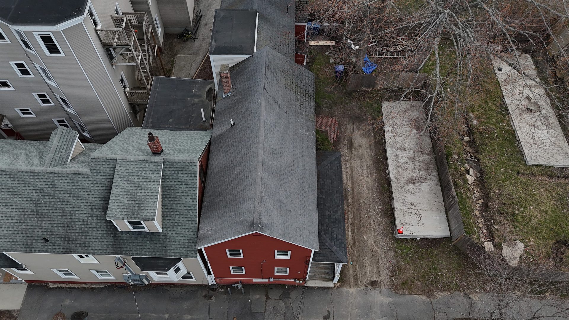 Top-down aerial view of the rooflines and the vacant lot at 200 Oxford.